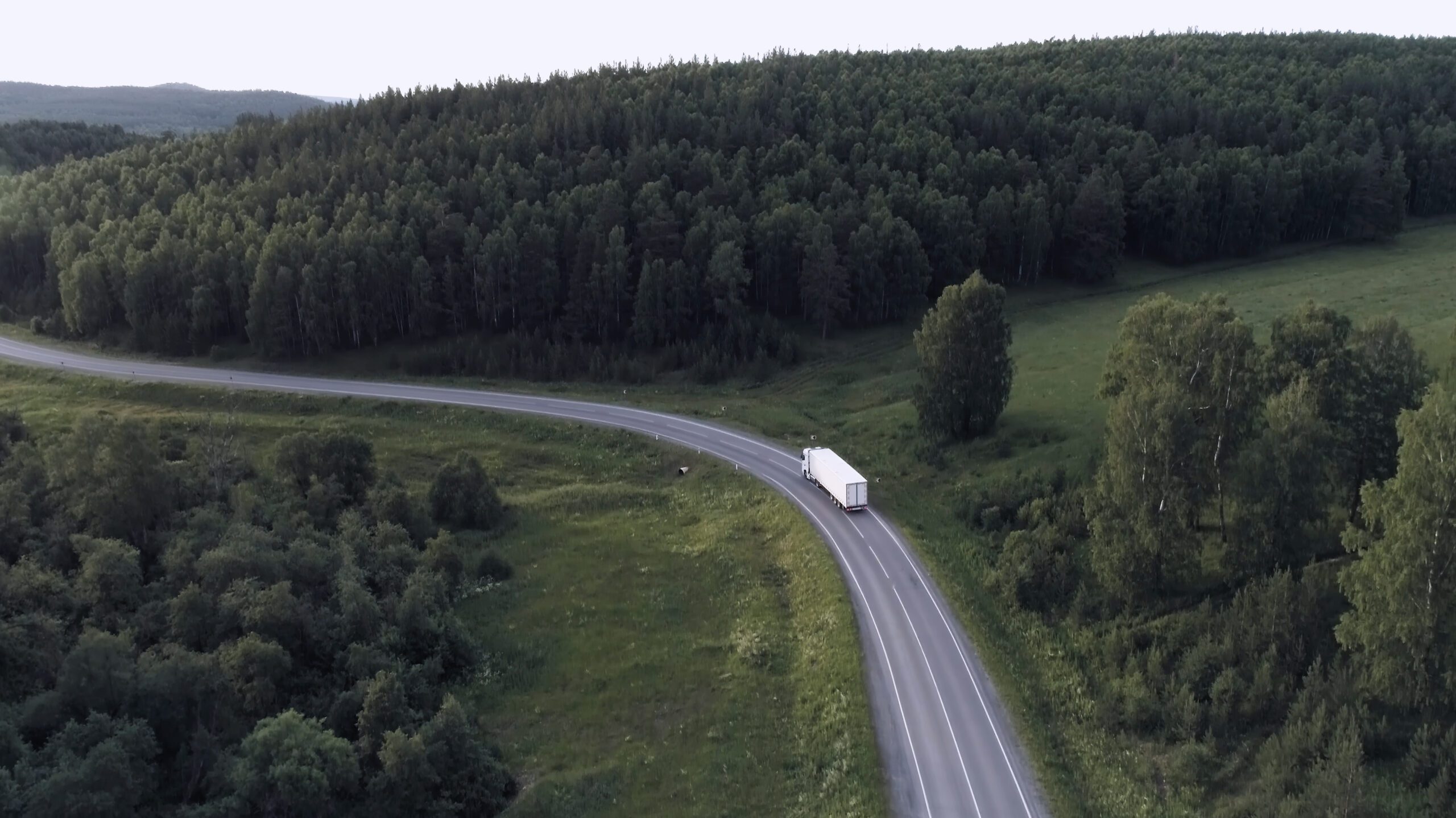 Aerial view of delivery truck driving through Yorkshire countryside
